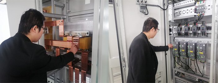 学员在生产线察看动力控制柜体内的器件及安装.jpg